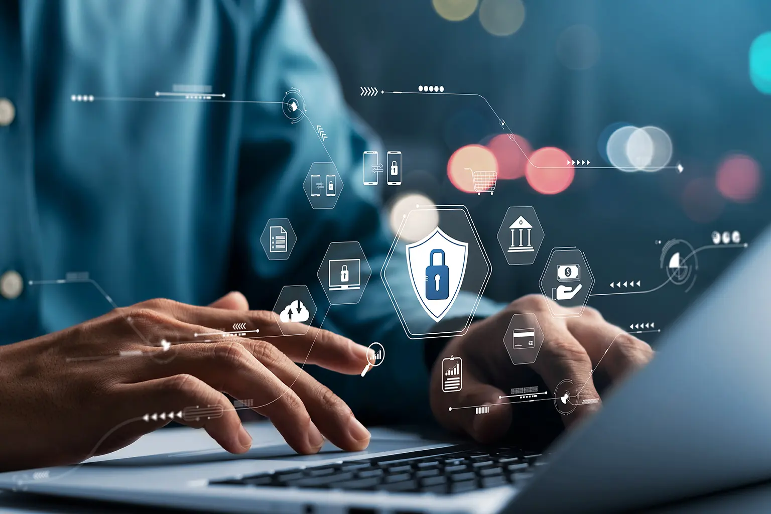 Person typing on a laptop with security and technology icons overlay, including a shield with a lock symbol, suggesting cybersecurity or data protection.